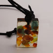 Bernstein-Collier in Acryl am Baumwollband