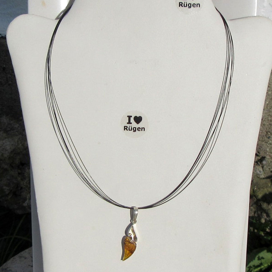 Filigranes Doppelherz aus Bernstein und Silber