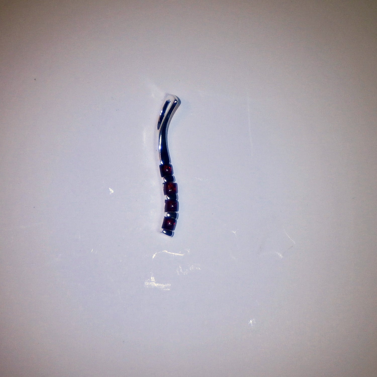 Länglicher Silberanhänger mit 4 kognacfarbenen Bernsteinen