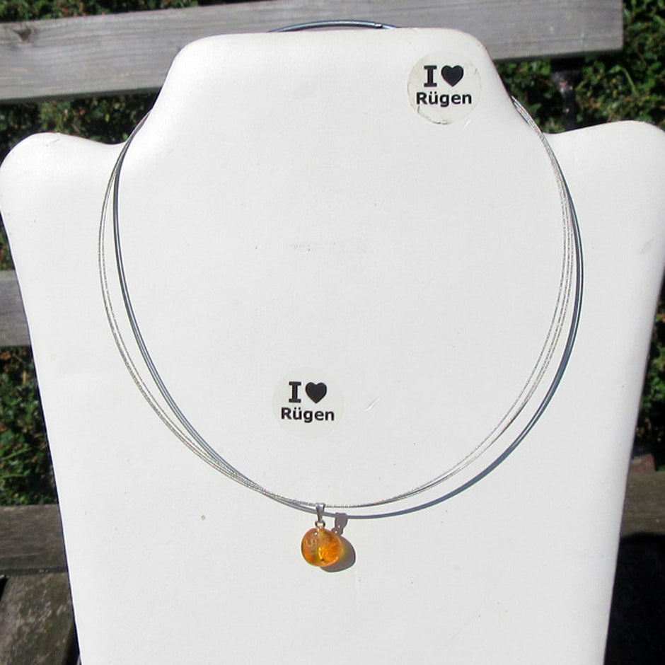 Bernsteinanhänger mit Inkluse – Einblick in die Vergangenheit