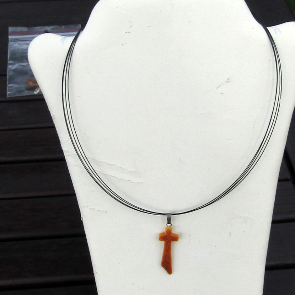 Schlankes Kreuz aus butterscotch Bernstein, Unikat