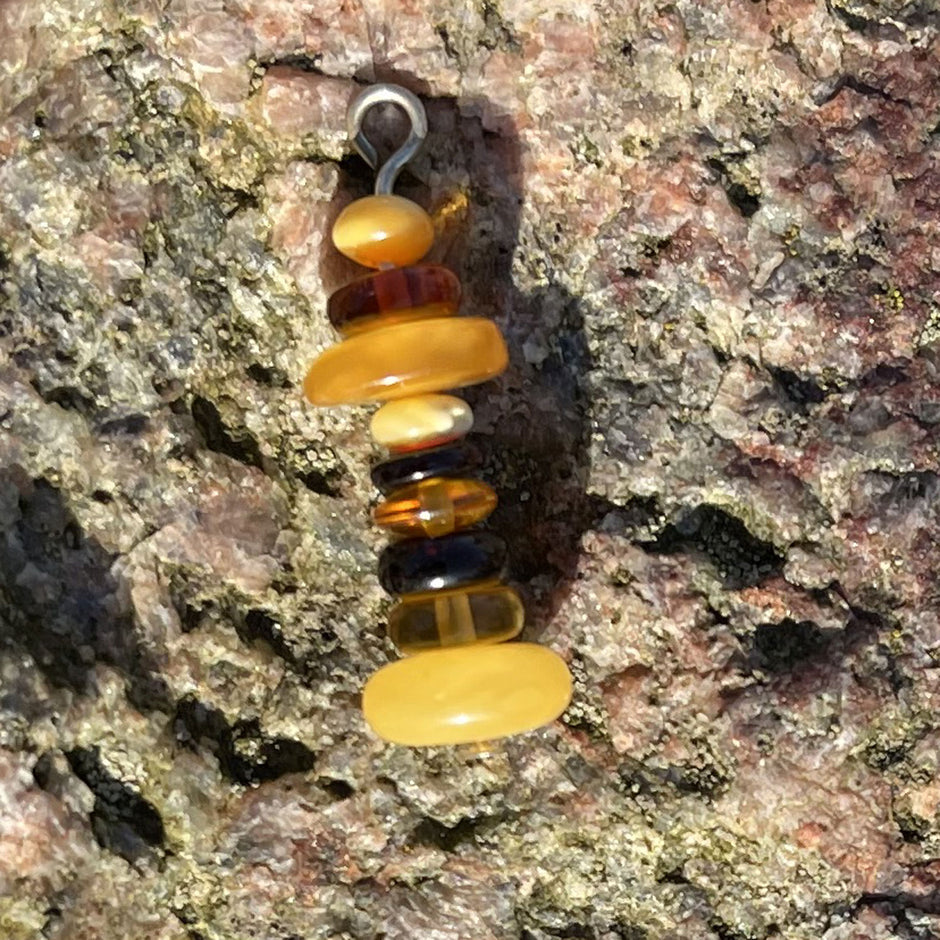 Einzelstück: Bernsteinleuchtturm am Baumwollband