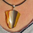 Einzelstück: Anhänger aus Bernstein und Holz mit Silber