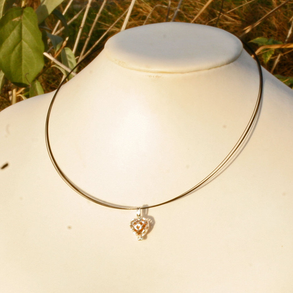 Aufklappbarer Herzanhänger mit Bernstein und Silber