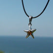 Kleiner Seestern aus Silber mit Bernsteinperle – Unikat