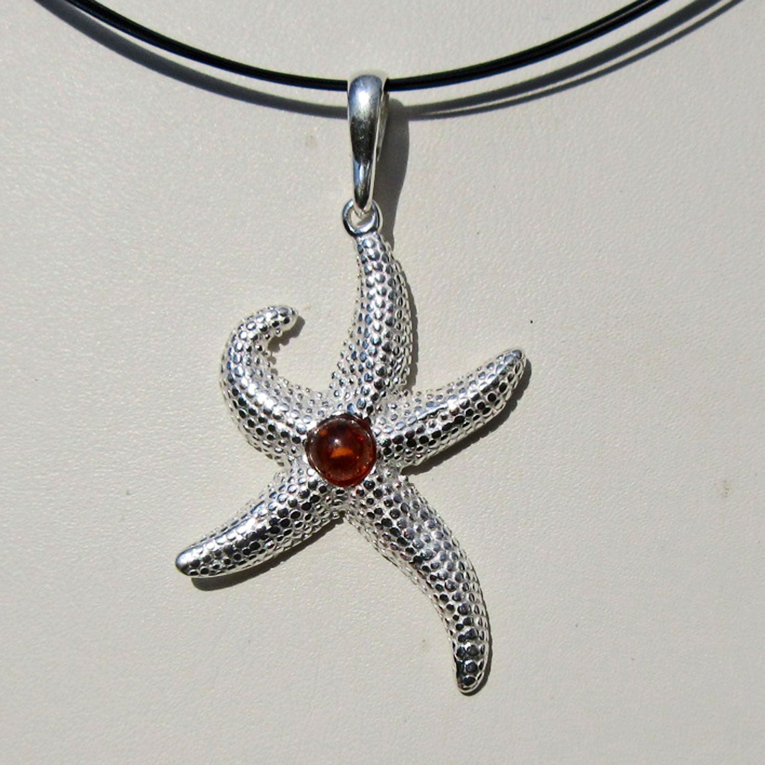 Silberanhänger Seestern mit Bernsteinperle, Unikat