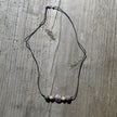 Collier mit Feuersteinkugeln und Fisch aus Silber