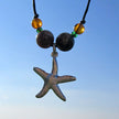 Collier aus Feuerstein und Bernstein mit silbernem Seestern