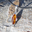 Bernsteinanhänger in Kognac mit Silber, Unikat