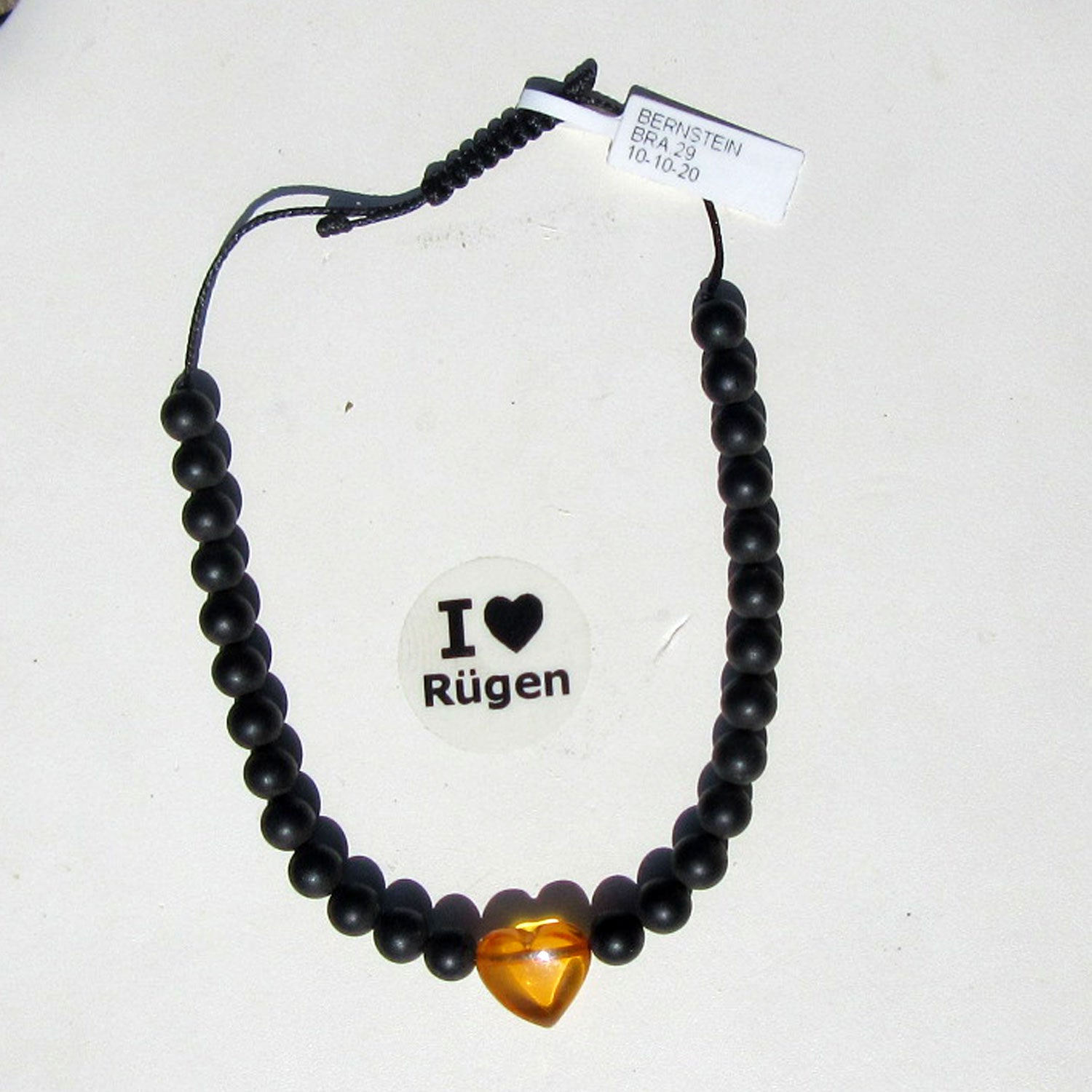 Verstellbares Armband mit Bernsteinperlen und Herz
