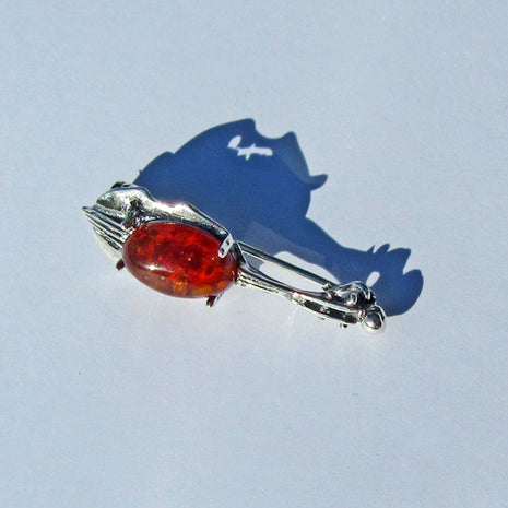 Brosche aus Silber und Bernstein in Cello-Form