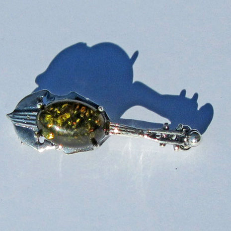Brosche aus Silber und bernsteinfarbenem Cello-Unikat