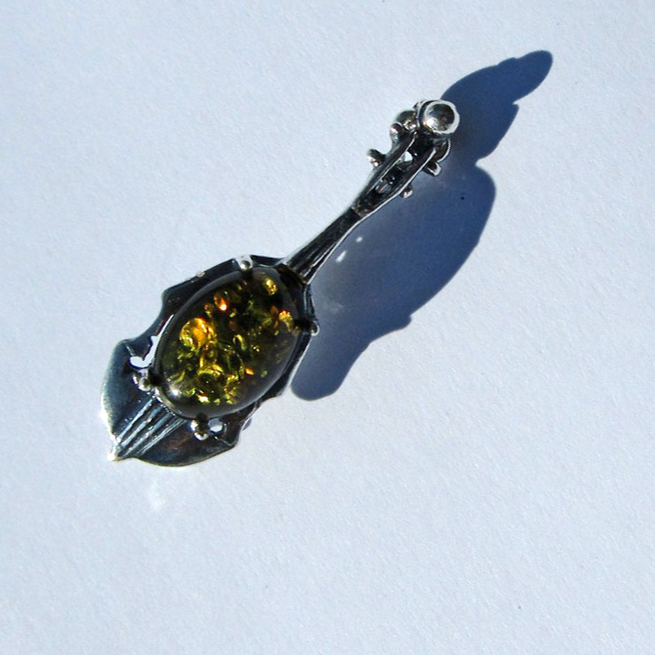 Brosche aus Silber und bernsteinfarbenem Cello-Unikat