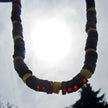 Bernsteinkette mit kirschroten und hellen Scheibchen