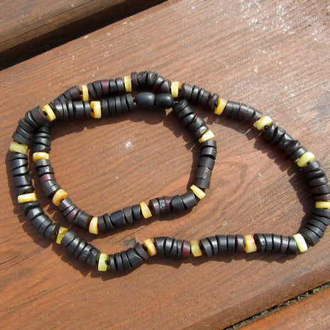 Bernsteinkette mit kirschroten und hellen Scheibchen