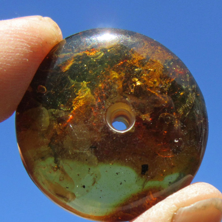 Bernsteindonut, poliert, mit Einschlüssen, Unikat