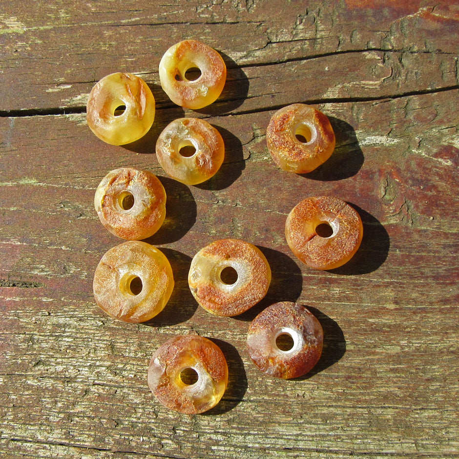 Handgeschliffener Bernsteindonut, unpoliert, Einzelstück