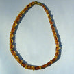 Kognacfarbene Bernsteinkette in Walzenform, Unikat