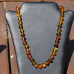 Einzelstück: Kette aus farbigen, unregelmäßigen Bernsteinperlen