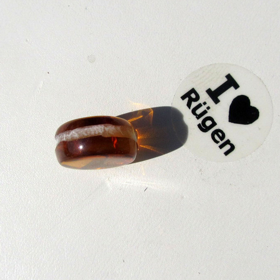 Kognacfarbener Bernsteinplug für das Ohr, Unikat