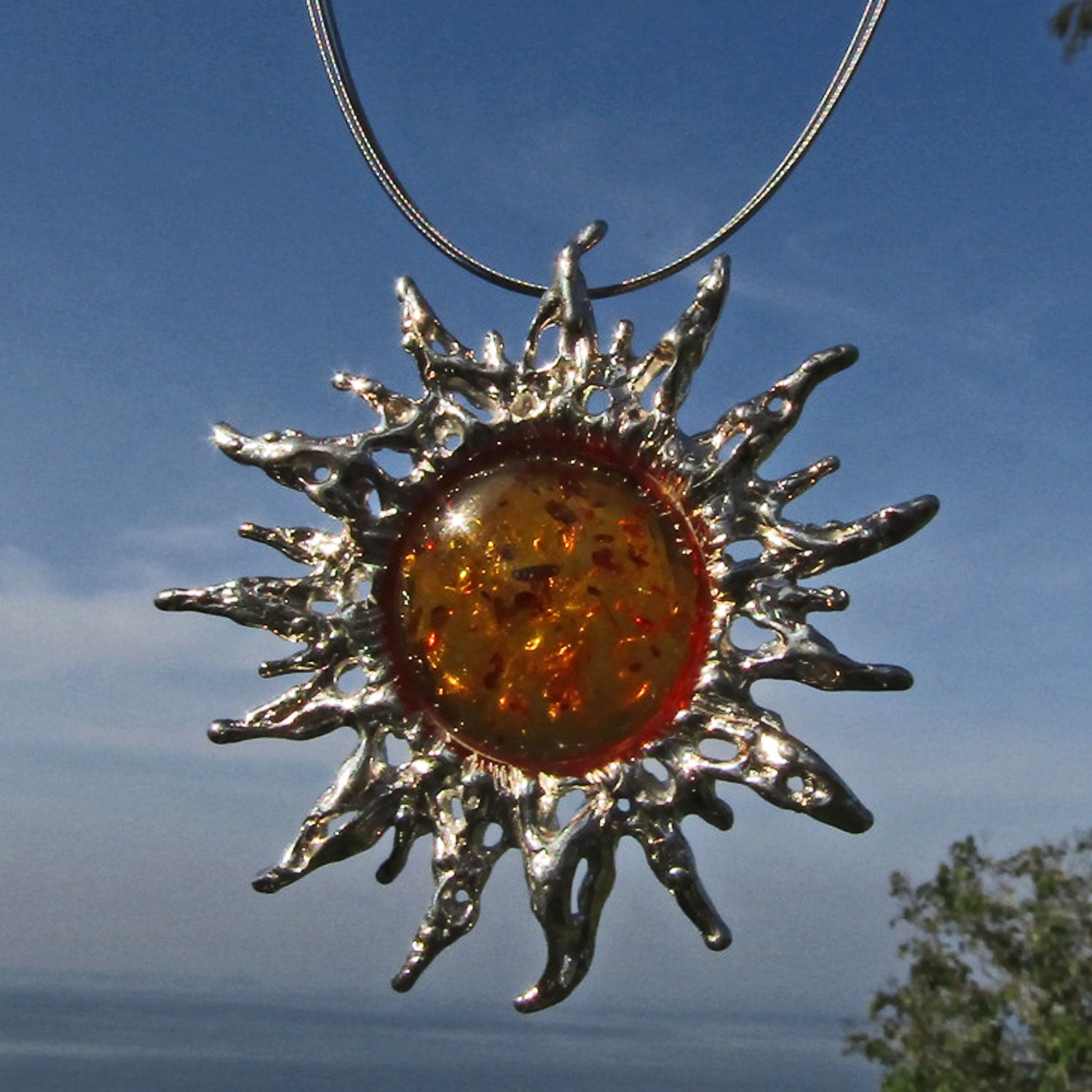 Großer Sonnenschein-Anhänger aus Silber mit Bernstein