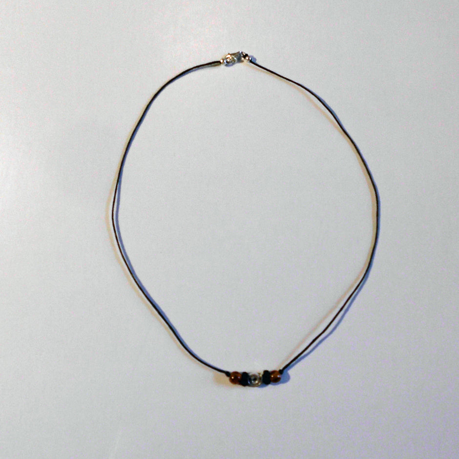 Bernsteincollier mit silberner Spirale und Holzperle