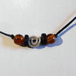 Bernsteincollier mit silberner Spirale und Holzperle
