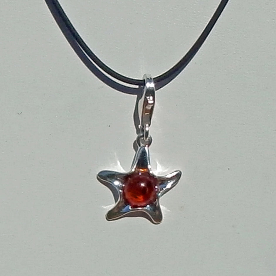 Silberanhänger Seestern mit kognacfarbenem Bernstein