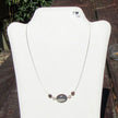 Elegantes Drahtcollier mit Feursteinolive und Silber-Schnecken
