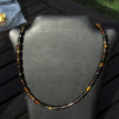 Collier aus polierten Bernsteinwalzen mit Silber und Glasperlen