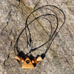 Collier aus Bernstein und Holzperlen, dreieckig und einzigartig