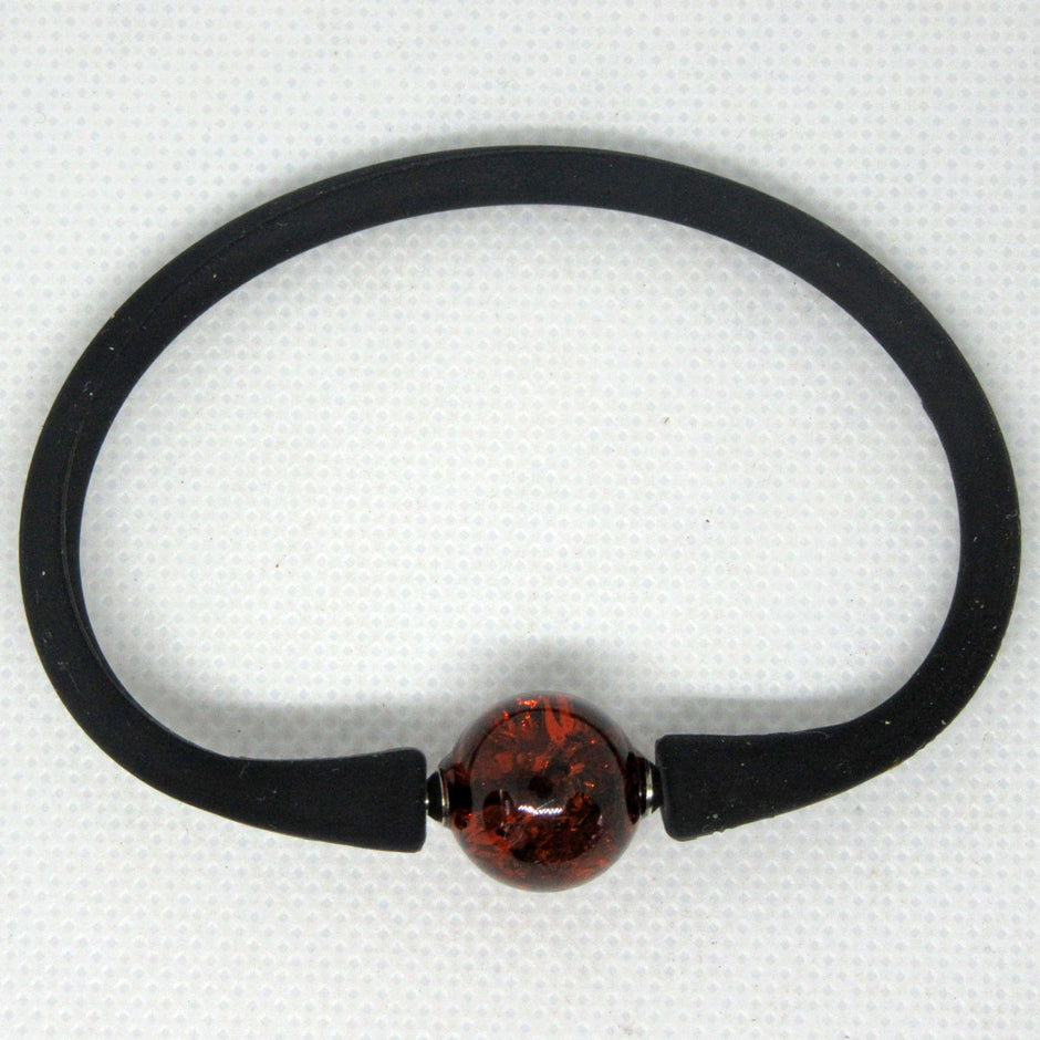 Silikonarmband mit kognacfarbener Bernsteinperle, Unikat