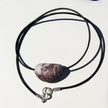 Ledercollier mit rötlichem Orthoceras von Rügen
