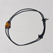 Lederarmband mit kognacfarbener Bernsteinwalze