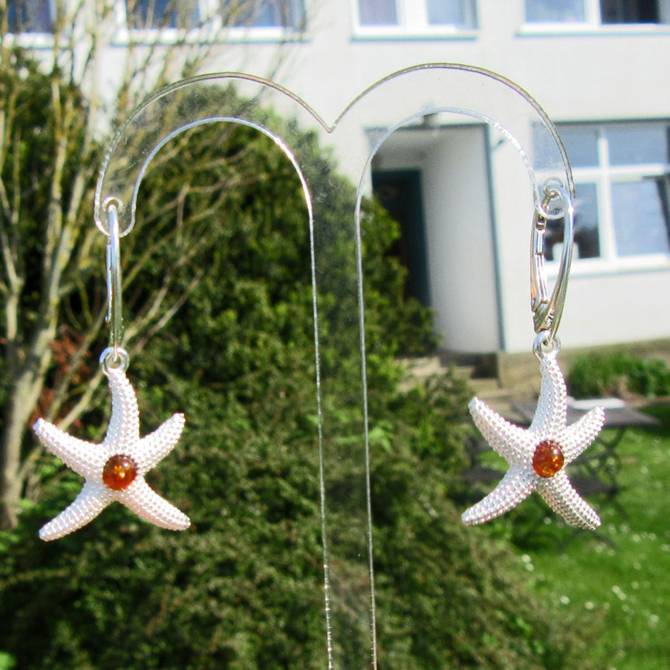 Silberner Ohrhänger Seestern mit Bernsteinperle, Unikat