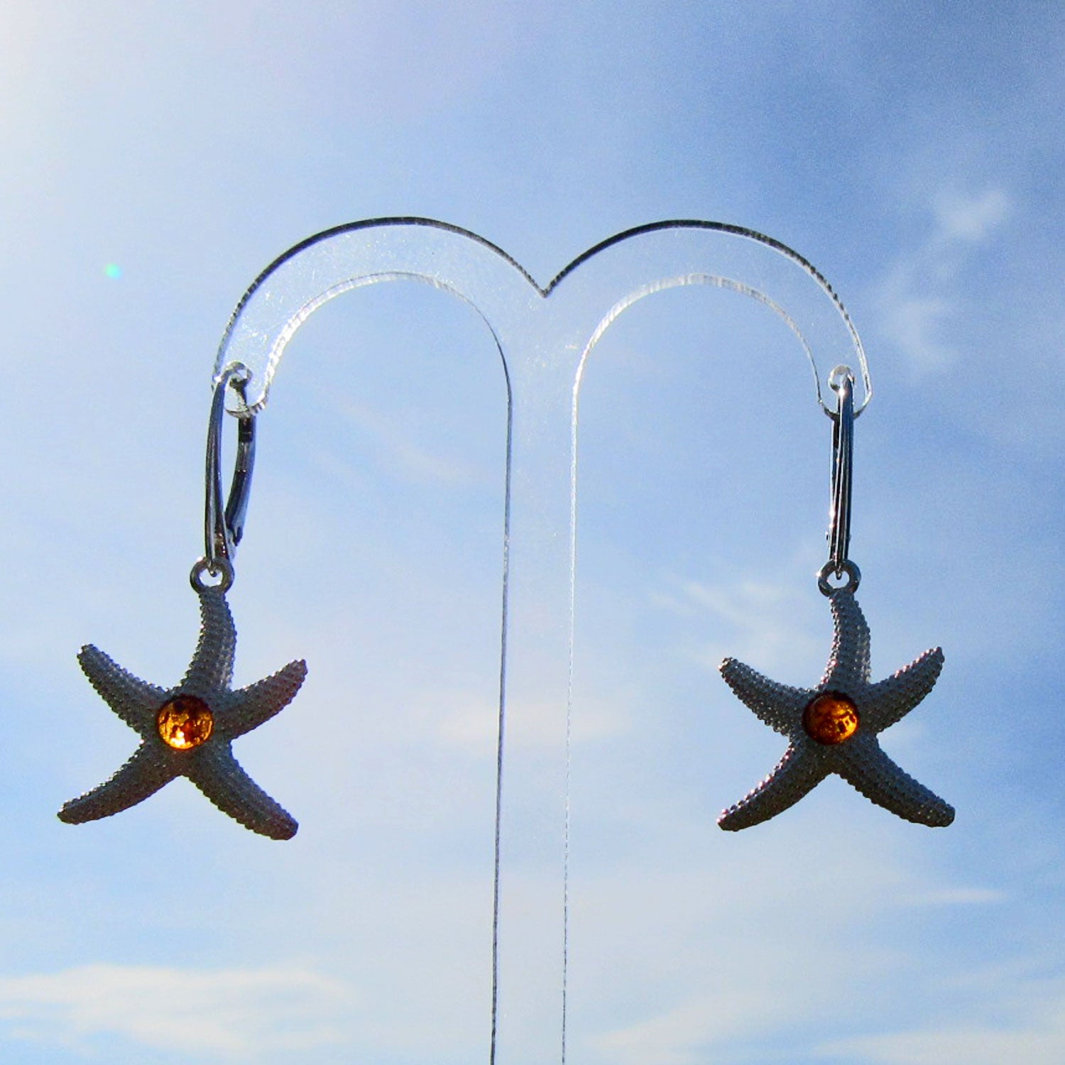 Silberner Ohrhänger Seestern mit Bernsteinperle, Unikat