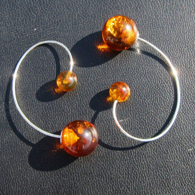 Bernstein-Ohrhänger mit großen und kleinen Perlen, Unikat