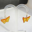 Ohrhänger aus Bernstein im Schmetterlingsdesign