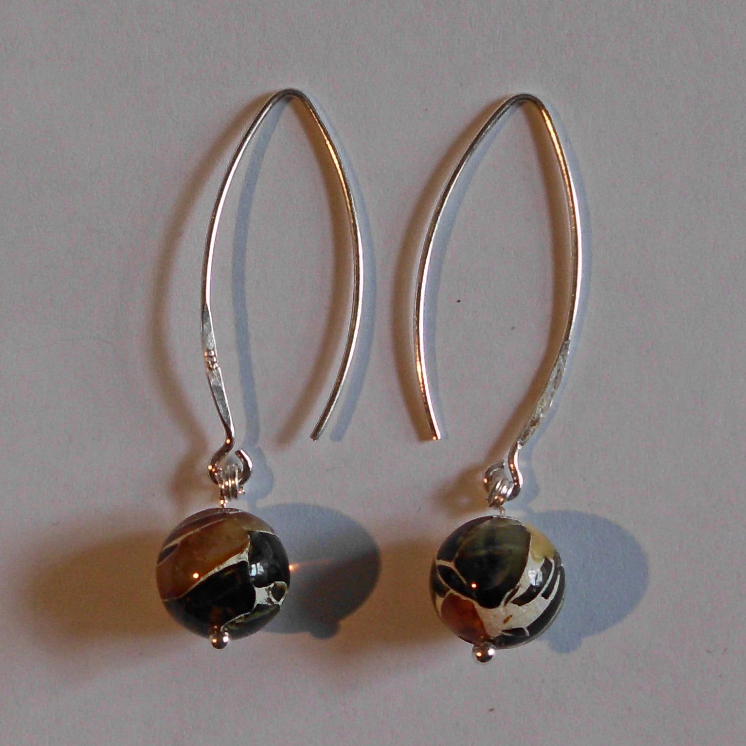 Ohrhänger aus Silber mit Bernsteinkugeln, Einzelstück