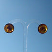 Silberne Ohrstecker mitpolierten, kognacfarbenenBernsteinscheiben