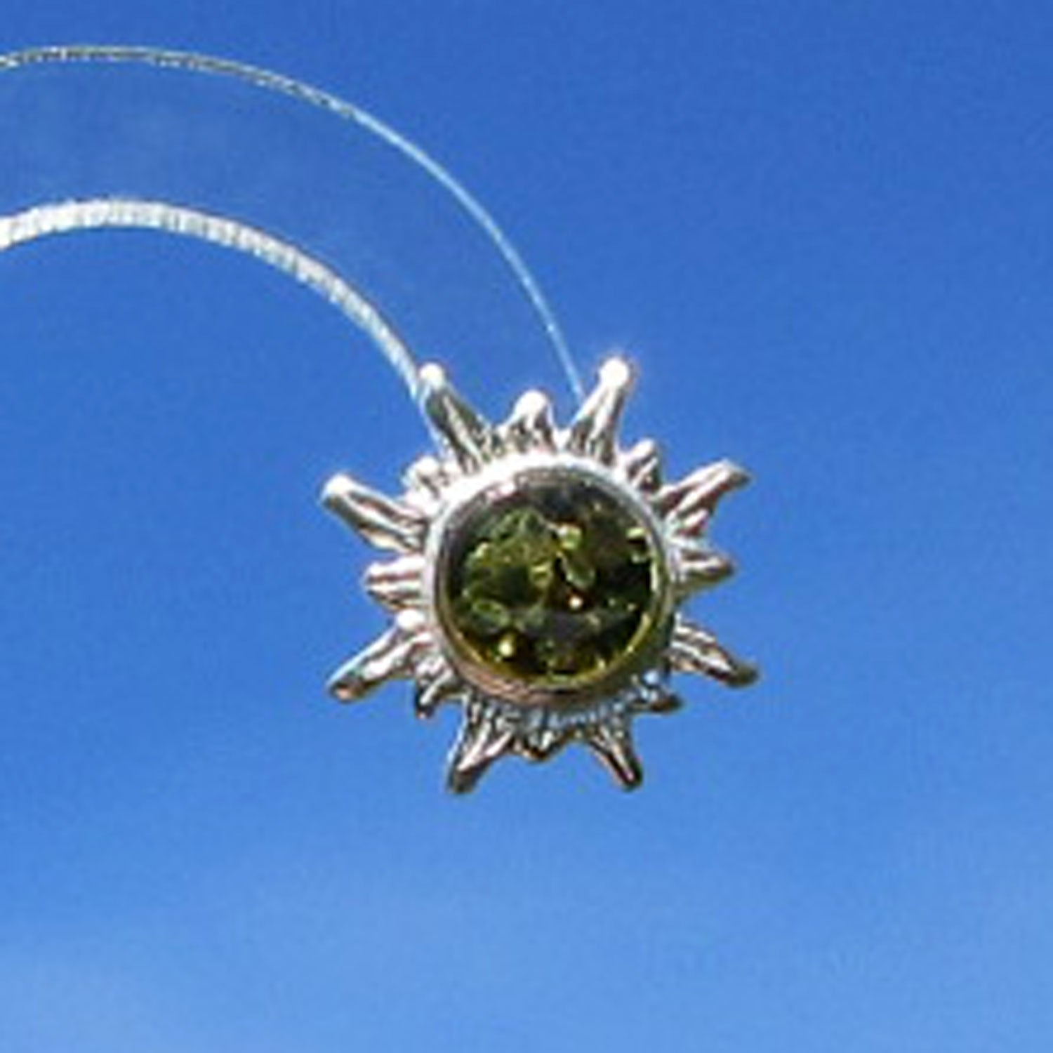 Ohrstecker Sonne aus kognacfarbenem Bernstein, Unikat