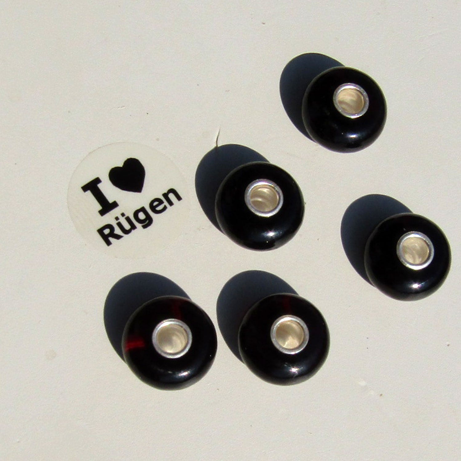 Bead aus kirschrotem Bernstein mit Einschlüssen für Pandora