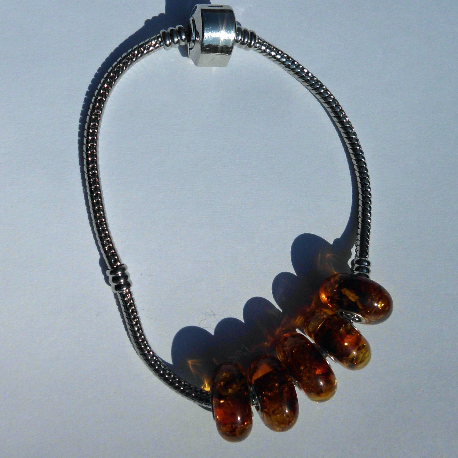 Kognacfarbener Bernstein-Bead mit Silberkern für Pandora