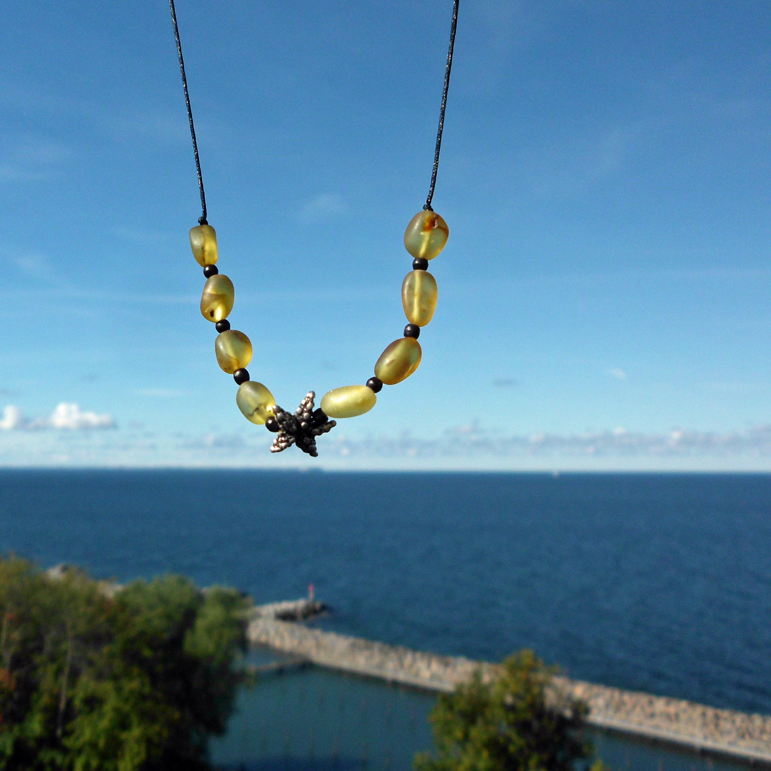 Collier mit Seestern aus Silber 925 und Bernsteinperlen