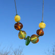 Seidencollier mit Bernsteinperlen und Seeglas, Unikat