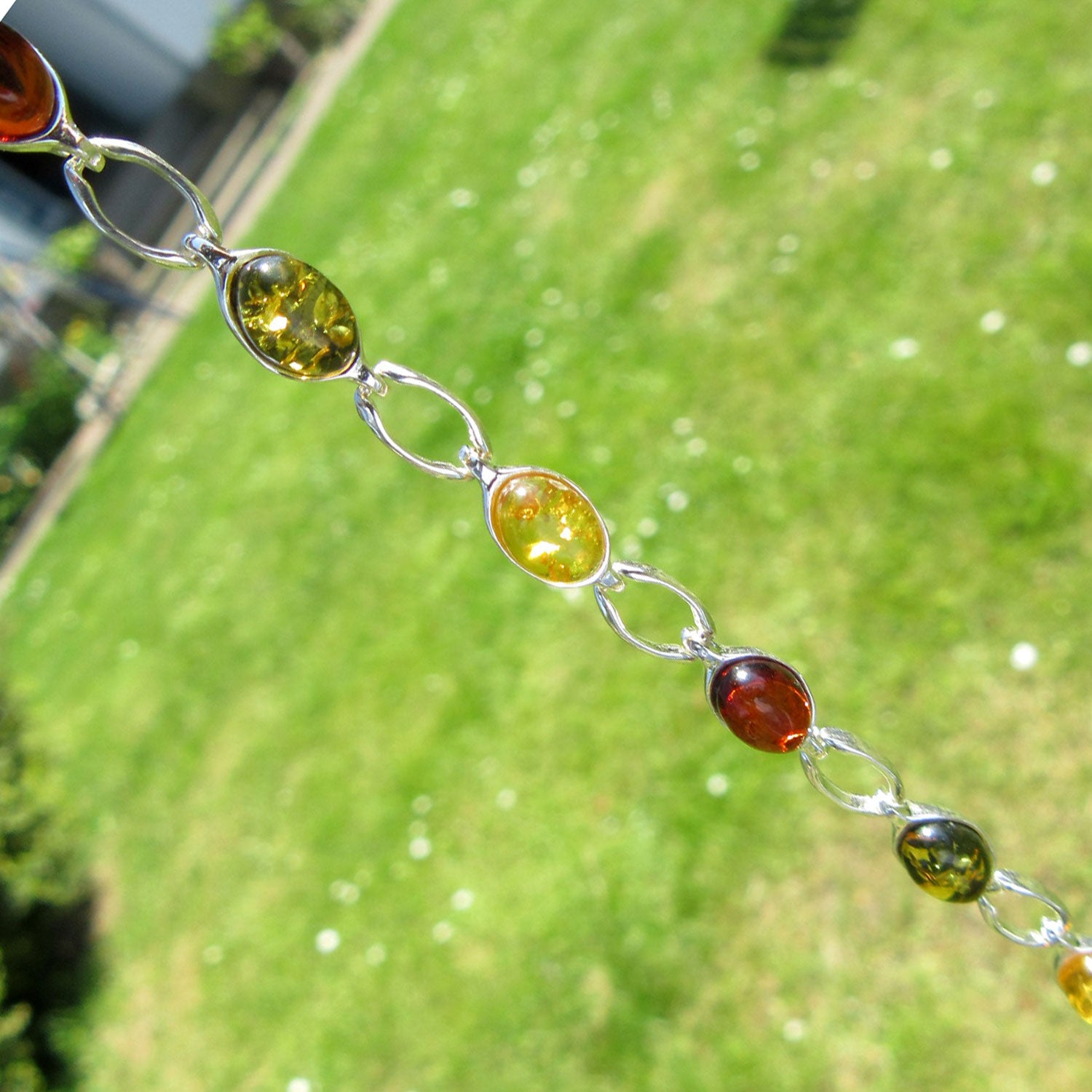 Silberarmband mit grünem und buntem Bernstein, Unikat