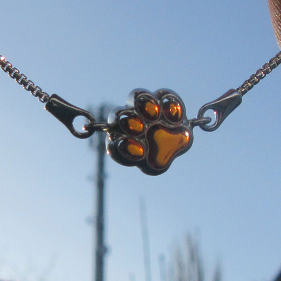 Elegantes Silberarmband mit Bernstein und Pfotenmotiv