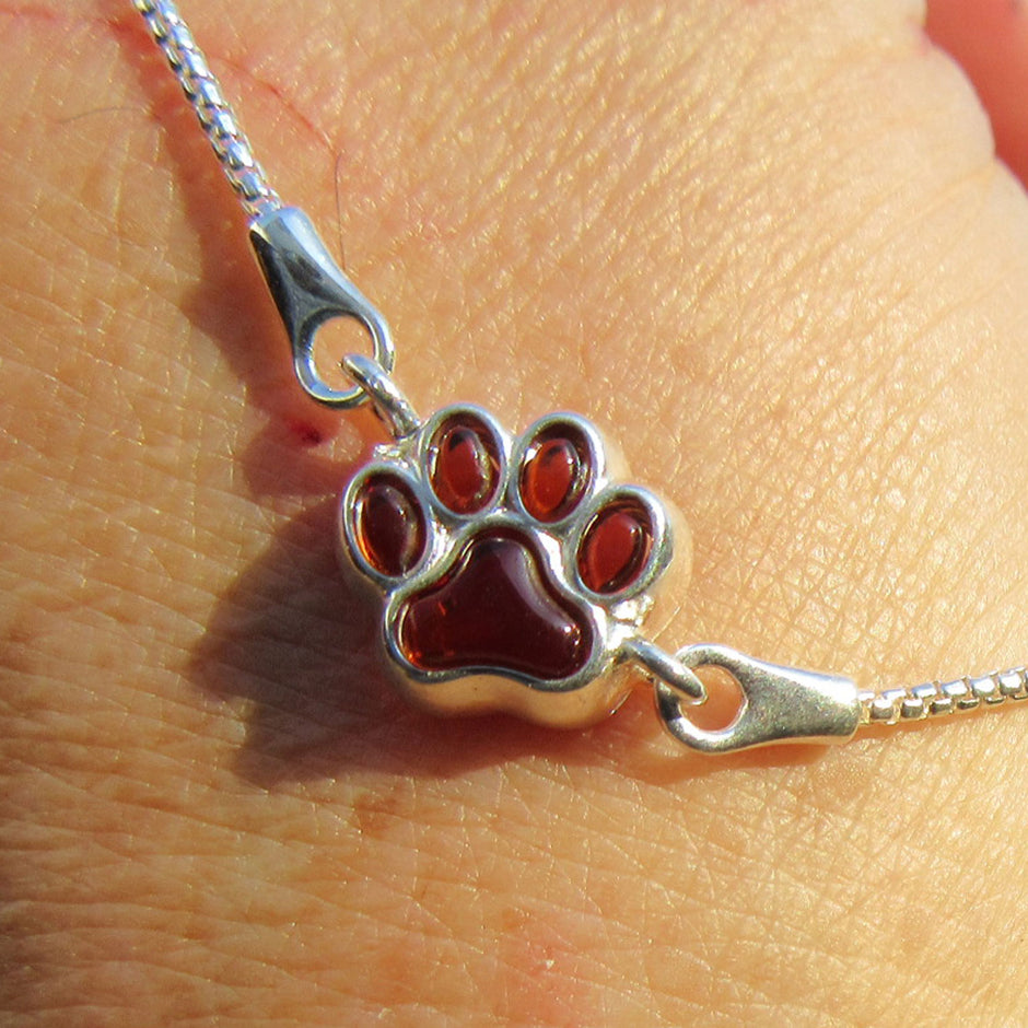 Elegantes Silberarmband mit Bernstein und Pfotenmotiv