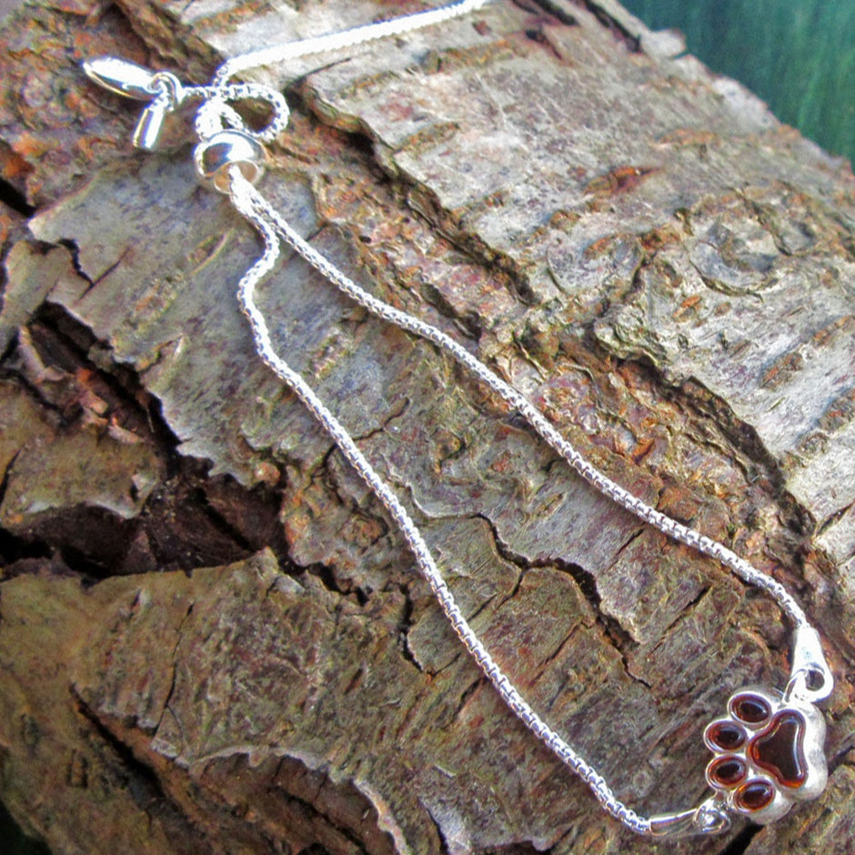 Elegantes Silberarmband mit Bernstein und Pfotenmotiv